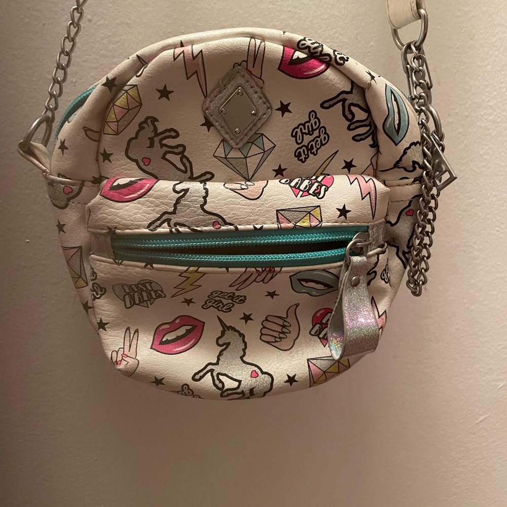 white purse with cartoons on it